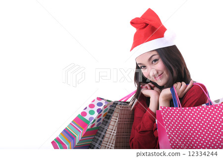 Christmas woman holding shopping bag 12334244
