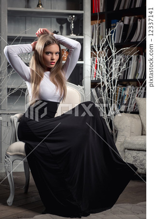 Elegant young woman in long dress posing in luxury vintage interior Elegant young woman in long dress posing in luxury vintage interior 12337141