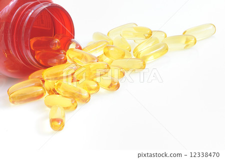 yellow fish oil capsule pile yellow fish oil capsule pile 12338470
