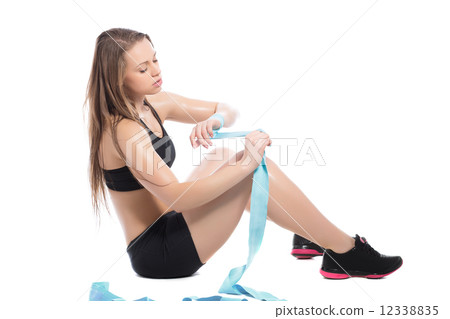 Young woman wearing black sport clothes 12338835