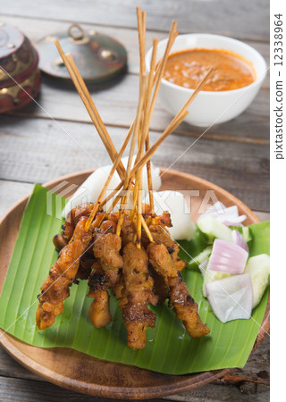 delicious malaysian satay with curry sauce 12338964