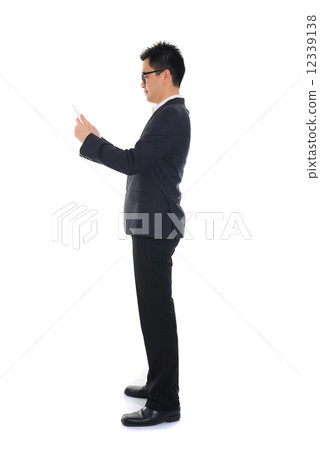 chinese business man using tablet 12339138