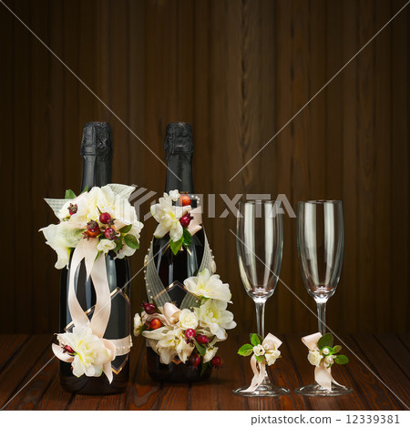 Champagne Bottles with Glass and Wedding Decoration of Flower Ar Champagne Bottles with Glass and Wedding Decoration of Flower Ar 12339381