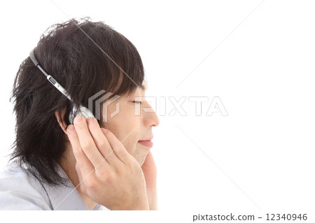Young man listening to music 12340946
