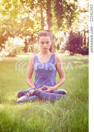 beautiful teenage girl meditates in nature beautiful teenage girl meditates in nature 12341507