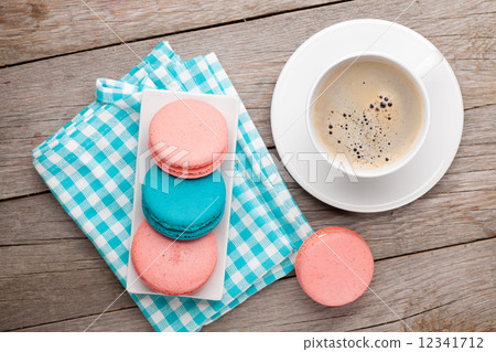 Colorful macaron cookies and cup of coffee Colorful macaron cookies and cup of coffee 12341712