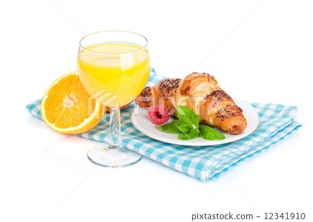 Orange juice and fresh croissant 12341910