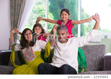 happy indian family enjoying quality time at home indoor 12343041