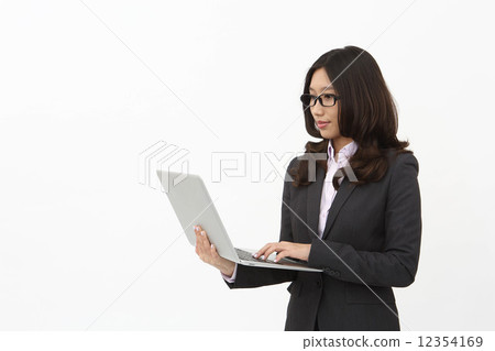 Asian business woman with laptop Asian business woman with laptop 12354169