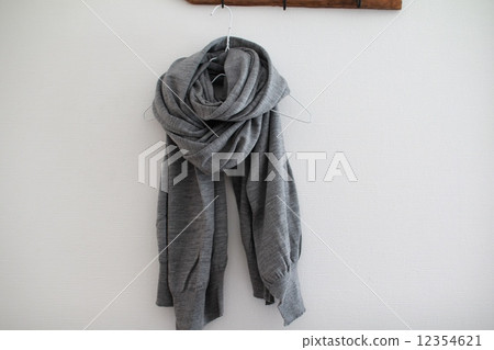 A large grey wool scarf hanging on the wall - Winter scarf 12354621