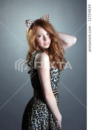 Image of cute red-haired girl in leopard costume 12354634
