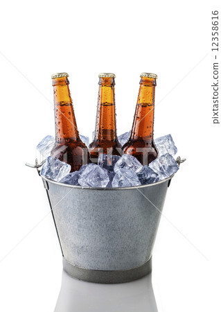 beer bottles in a bucket of ice beer bottles in a bucket of ice 12358616