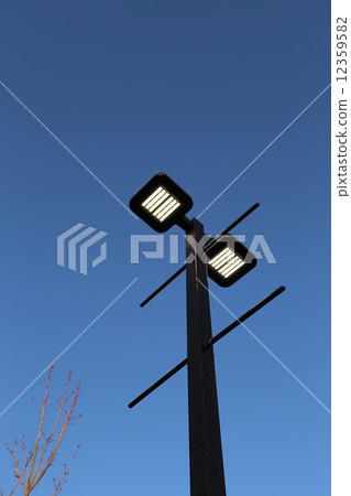 Road lamp against blue sky 12359582