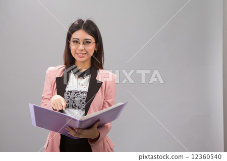 Happy lady pointing file 12360540