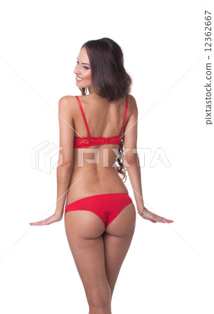 Rear view of smiling slim model in red lingerie Rear view of smiling slim model in red lingerie 12362667