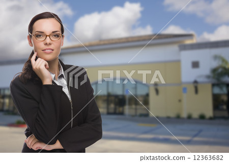 Woman In Front of Commercial Building Woman In Front of Commercial Building 12363682