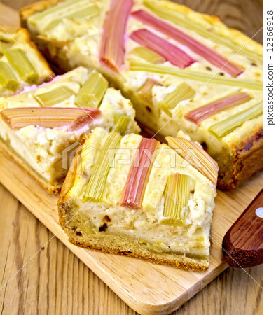 Pie with curd and rhubarb on board 12366918