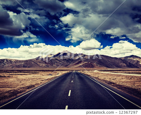 Road on plains in Himalayas with mountains 12367297