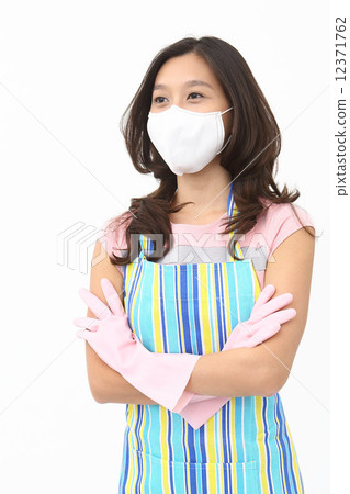 Asian women playing rubber gloves Asian women playing rubber gloves 12371762