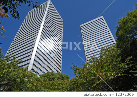 Twin tower building towering tremendously 12372309