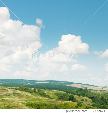 picturesque hills against the blue sky 12372621