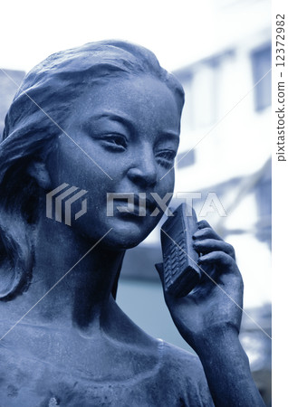 statue at the phone statue at the phone 12372982