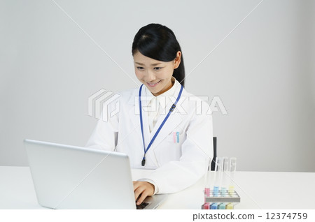 A scientist who inputs data to a personal computer A scientist who inputs data to a personal computer 12374759