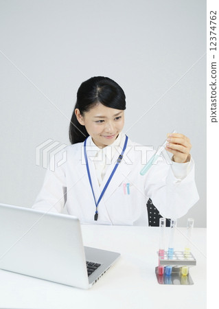 A scientist who inputs data to a personal computer A scientist who inputs data to a personal computer 12374762