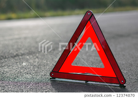Red triangle of a car 12374870