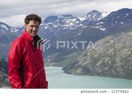 Dutch hiker at Knutshoe Mountain (Jotunheimen National Park, Opp 12374882
