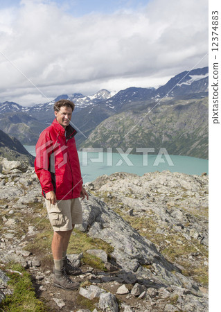 Dutch hiker at Knutshoe Mountain (Jotunheimen National Park, Opp 12374883