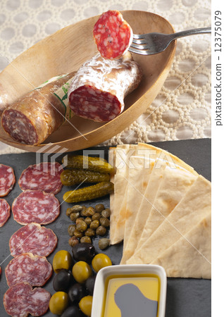 cold cut platter with pita bread and pickles 12375079