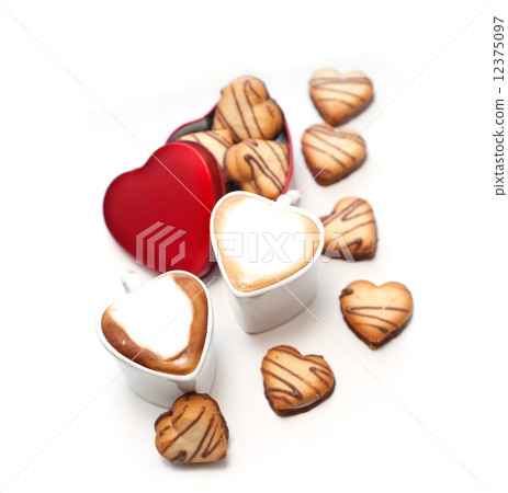 heart shaped cream cookies on red heart metal box and coffee heart shaped cream cookies on red heart metal box and coffee 12375097