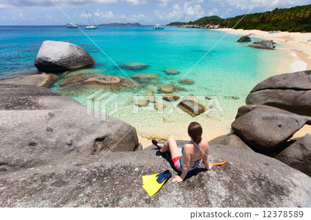 Woman with snorkeling equipment at tropical beach Woman with snorkeling equipment at tropical beach 12378589