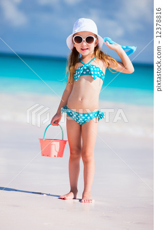 Adorable little girl at beach Adorable little girl at beach 12378816
