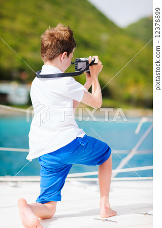 Teenage boy with camera Teenage boy with camera 12378899