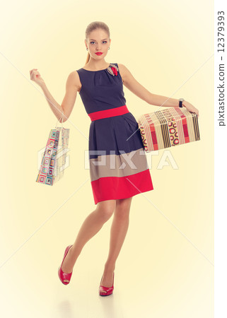 girl with a gift box and shopping bag girl with a gift box and shopping bag 12379393