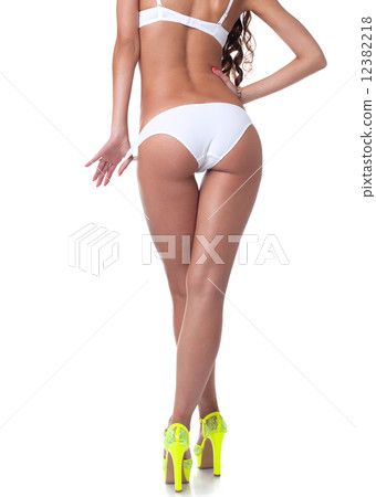 Rear view of long-legged slim model, close-up 12382218