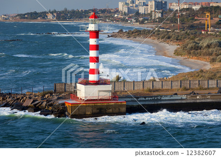 Lighthouse, stormy sea 12382607