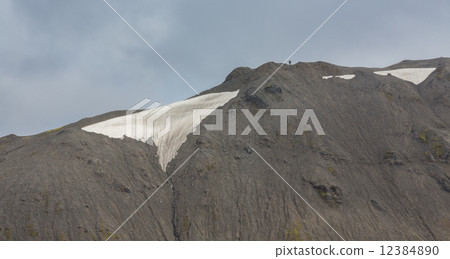 Tourists along the ridge in Landmannalaugar lava landscape 12384890
