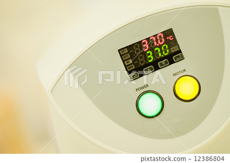 Blood analyzer, with temperature monitor and two big buttons, medical equipment  12386804