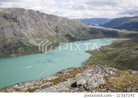 Lake Gjende seen from Knutshoe Mountain (Norway) 12387145
