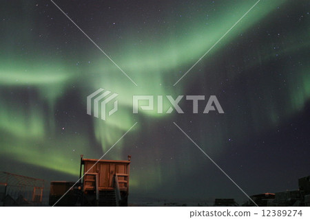 Wooden building and aurora 12389274
