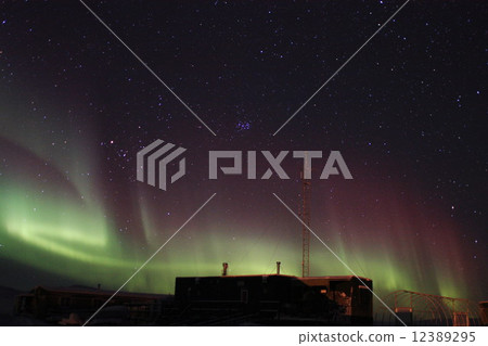 Wooden building and aurora 12389295
