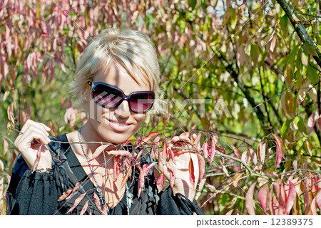 Beautiful woman in autumn leaves 12389375