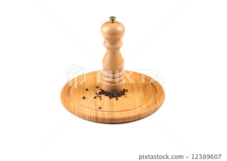 Pepper mill and black peppercorn 12389607