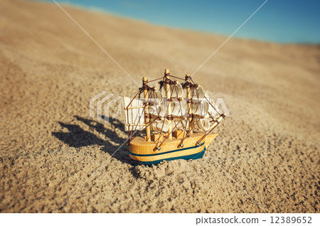 Sailing ship model on sand Sailing ship model on sand 12389652