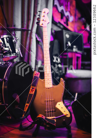 electric bass guitar on the rack at concert 12389662