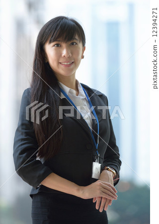 One successful young chinese business woman showing her name access card One successful young chinese business woman showing her name access card 12394271