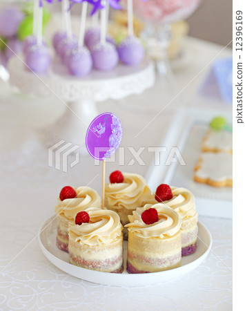Sweet holiday buffet with cupcakes and cake-pops 12396169